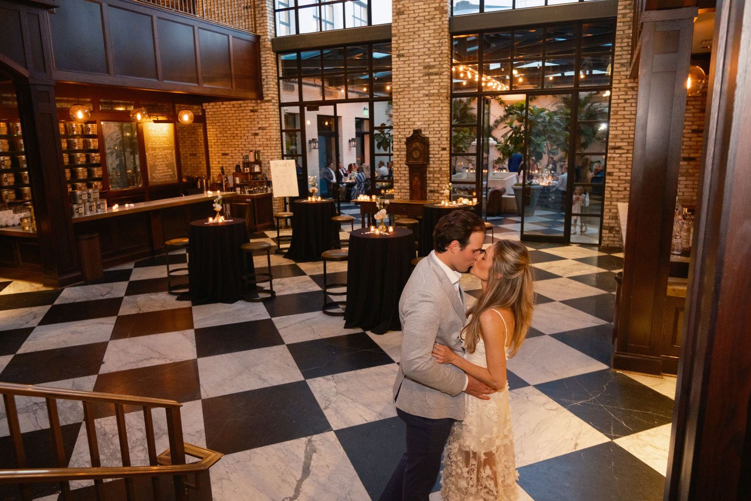 Bride and groom celebrating rehearsal dinner at Oxford Exchange wedding venue in Tampa FL