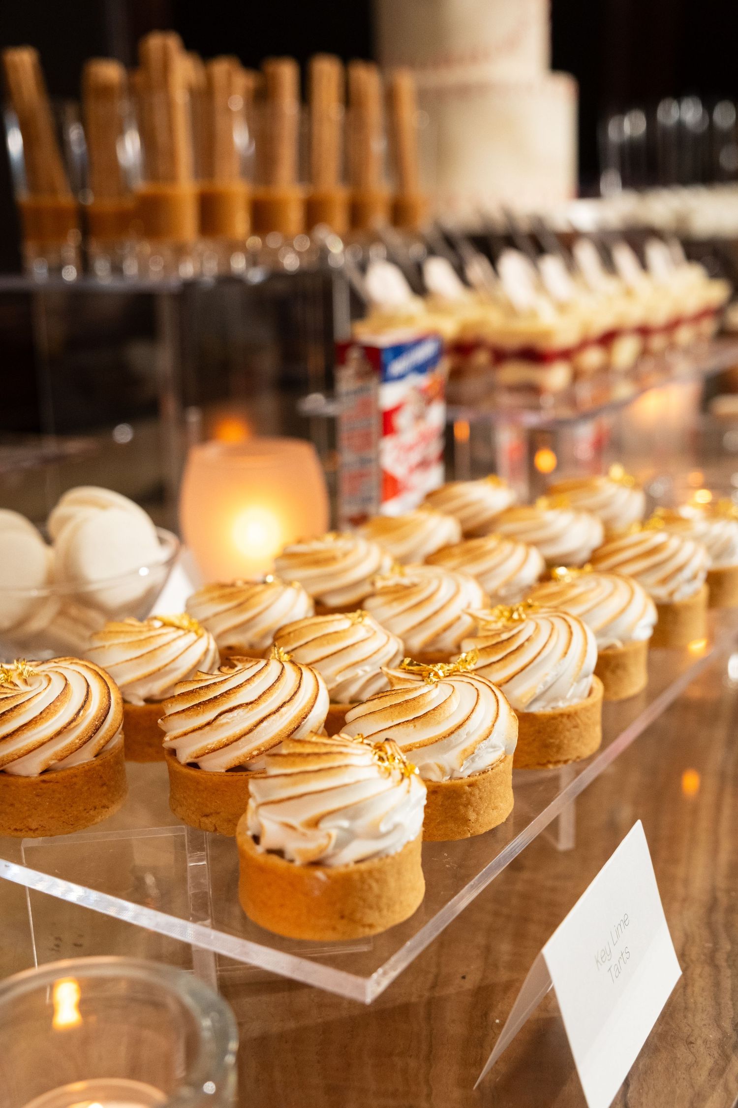 Oxford Exchange Tampa rehearsal dinner dessert table with cakes, macarons, and sweets by Hands on Sweets