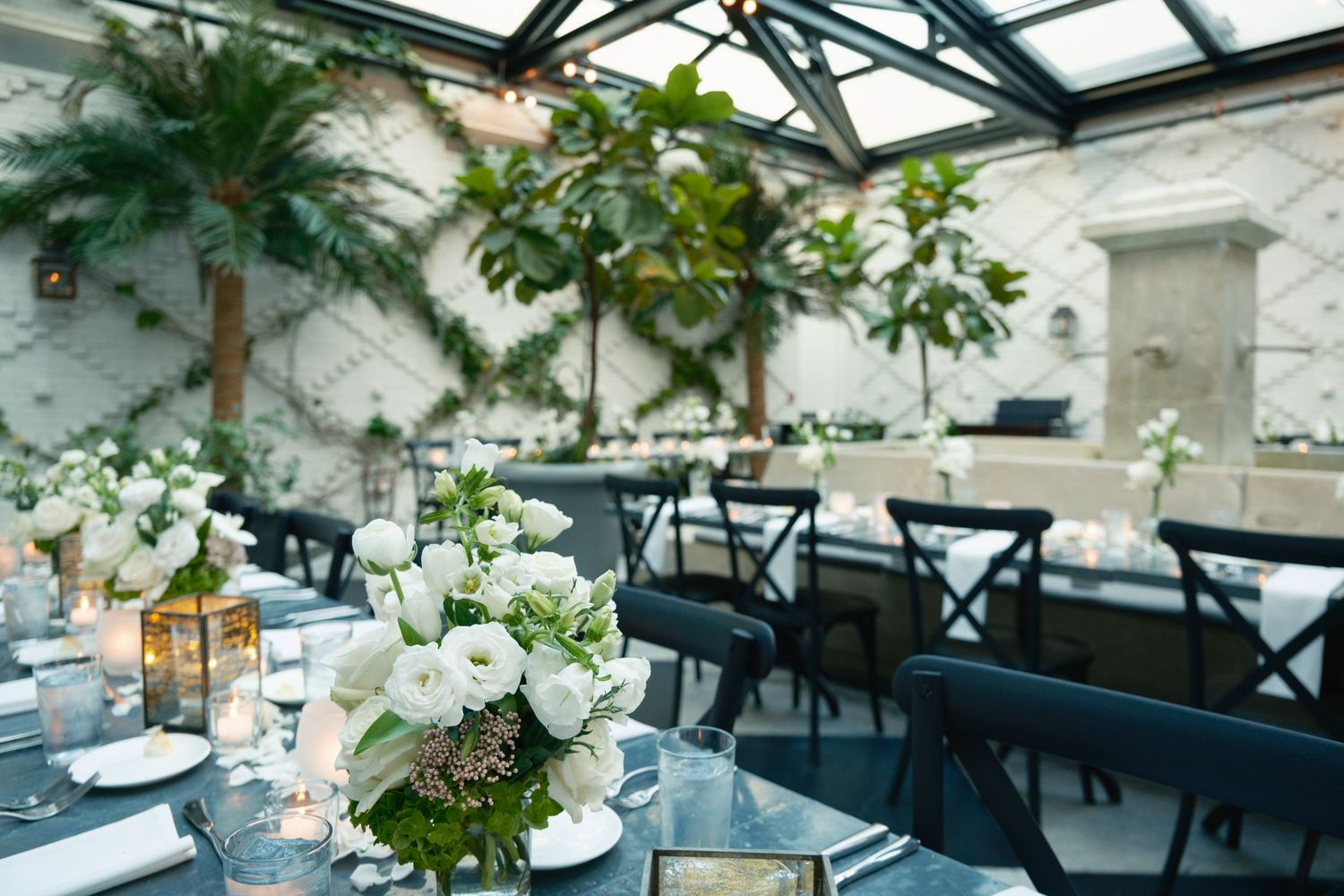 Floral table design and place settings at Oxford Exchange Tampa rehearsal dinner