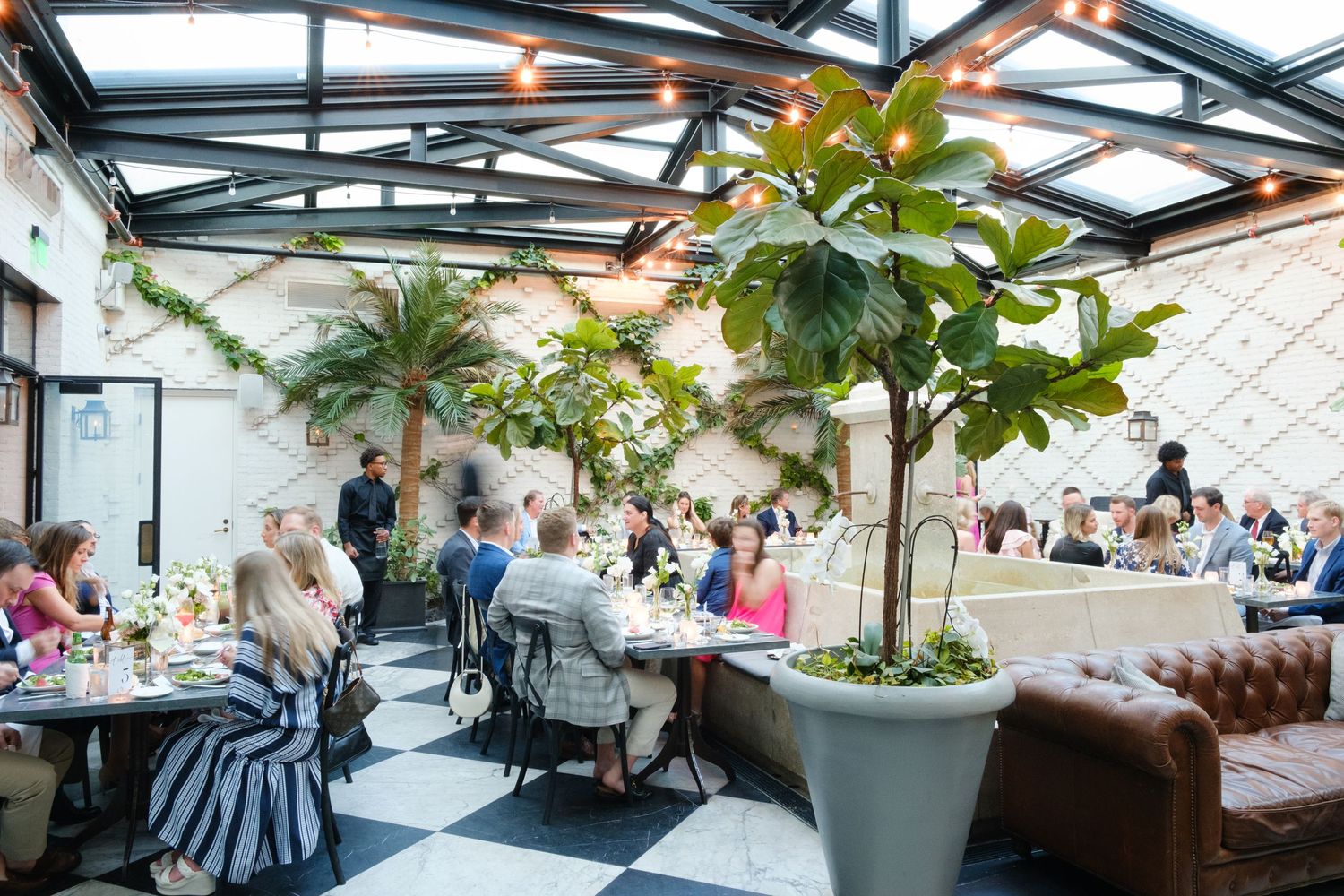 Intimate rehearsal dinner at Oxford Exchange Tampa wedding venue with elegant table styling
