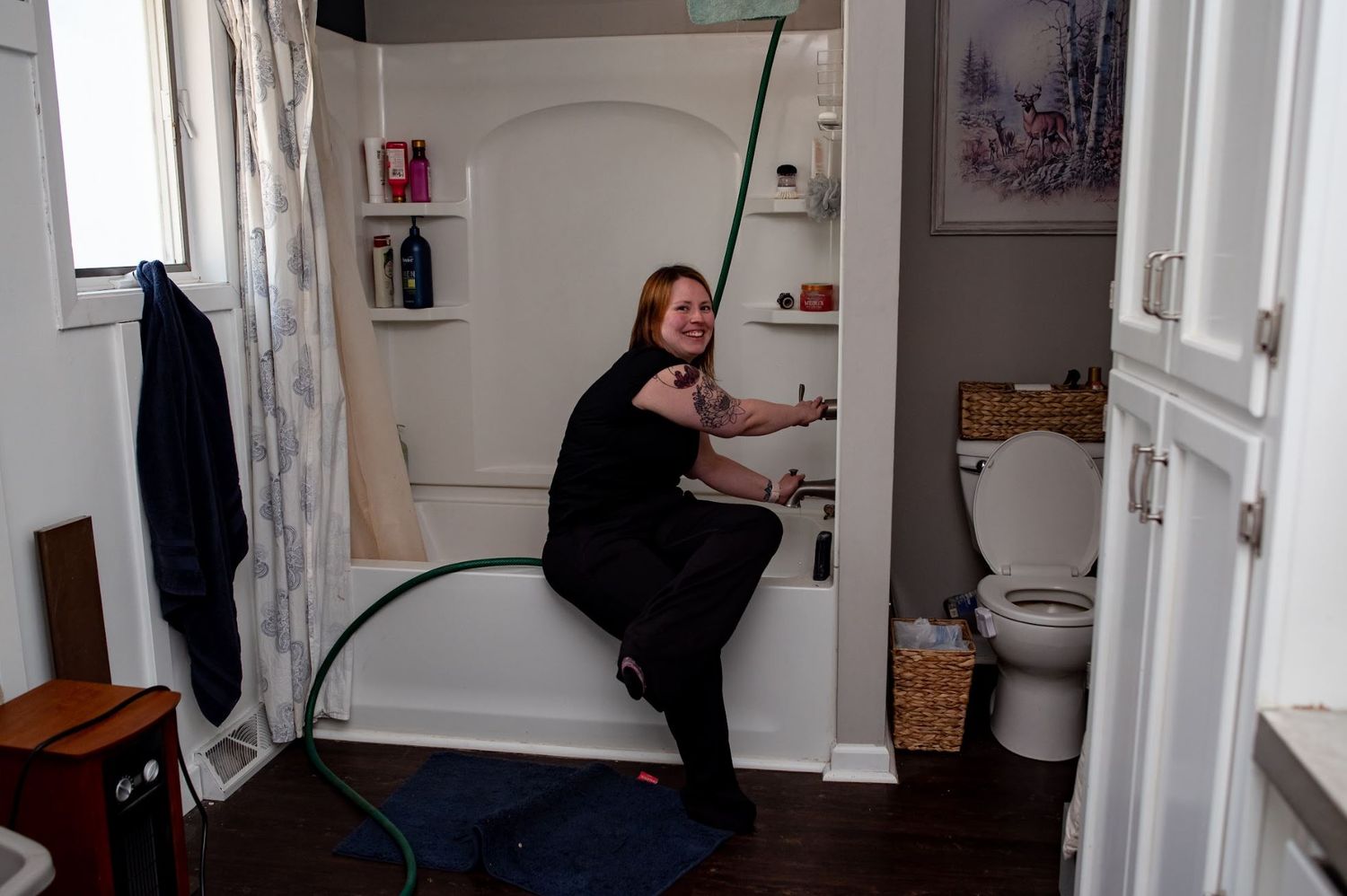 Doula filling the tub for a home birth
