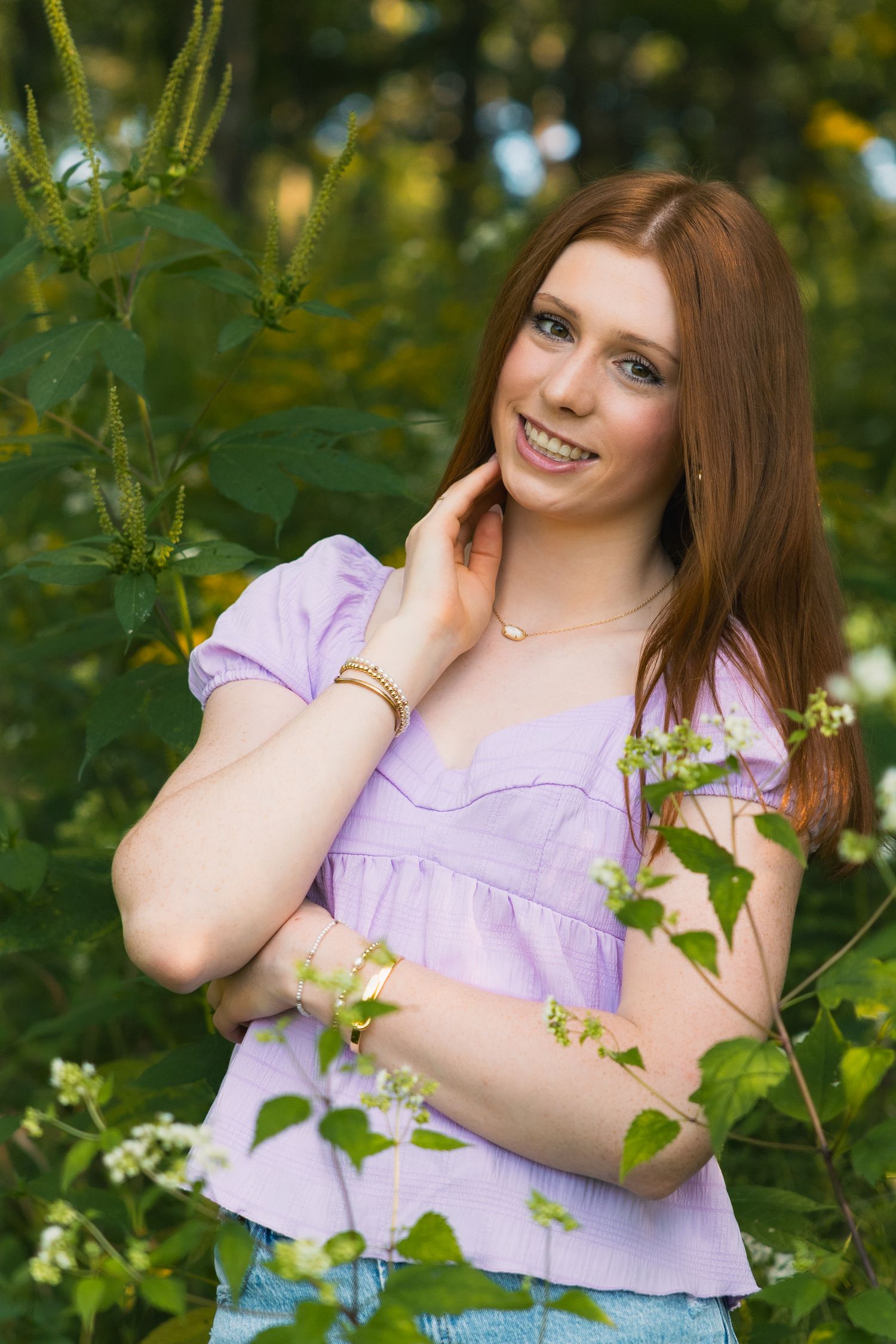 madison wi professional yearbook photos high school senior photographer waste up headshot girl posing green forest indian lake county park