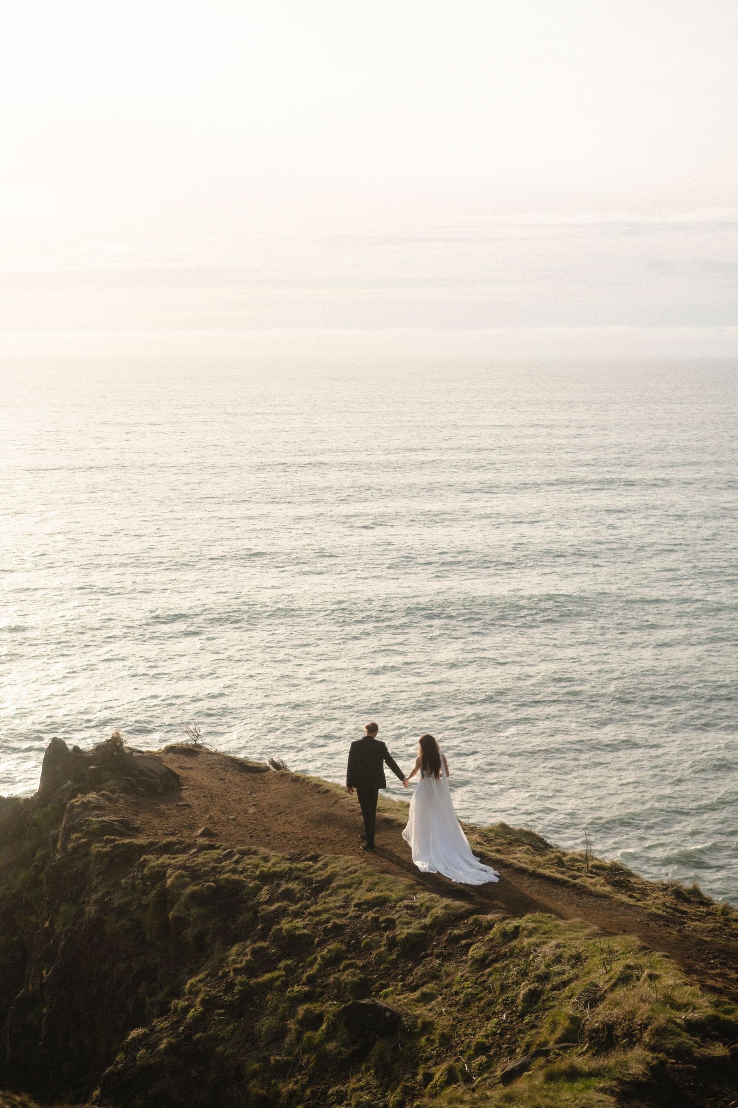 Bride and Groom on the cliff by the ocean