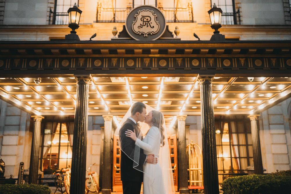 Bride and groom kiss outside The St. Regis Washington, D.C. wedding venue