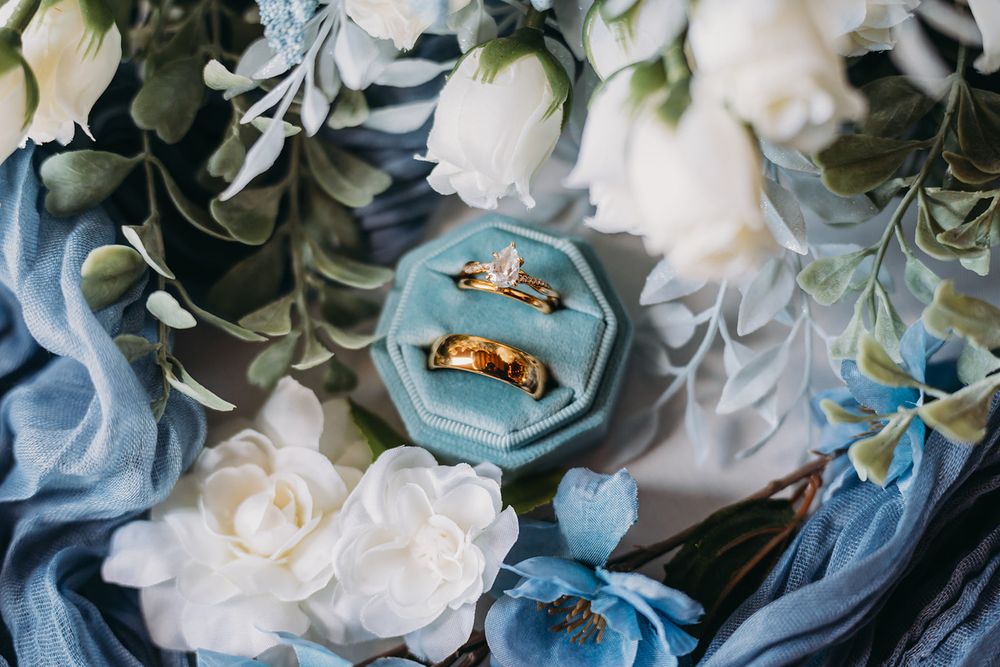 Wedding rings photographed in a velvet ring box with florals by Benson Park Photography