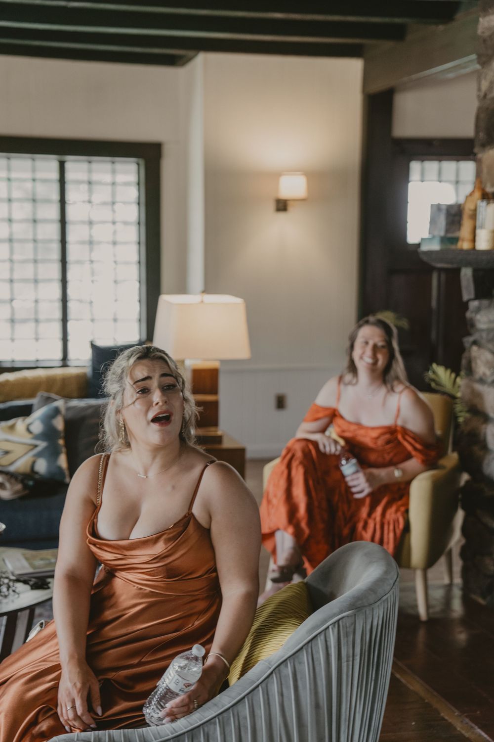 A candid sequence of laughing moments captured in a cozy indoor setting with orange accents.