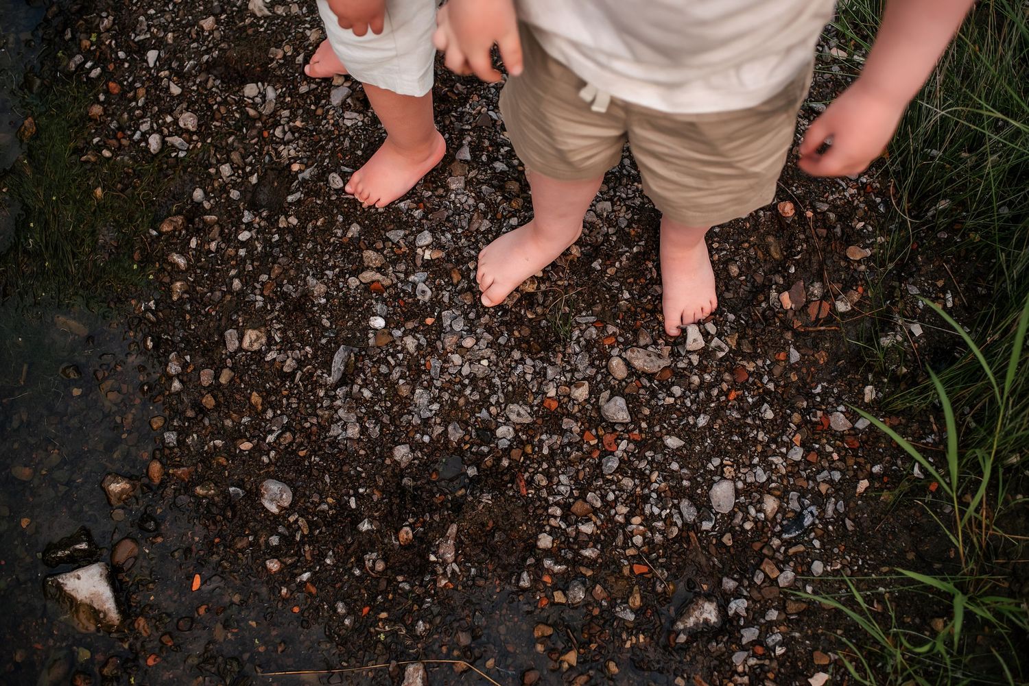 Documentary session with kids feet in the river - moody lifestyle family session in South Heart, ND