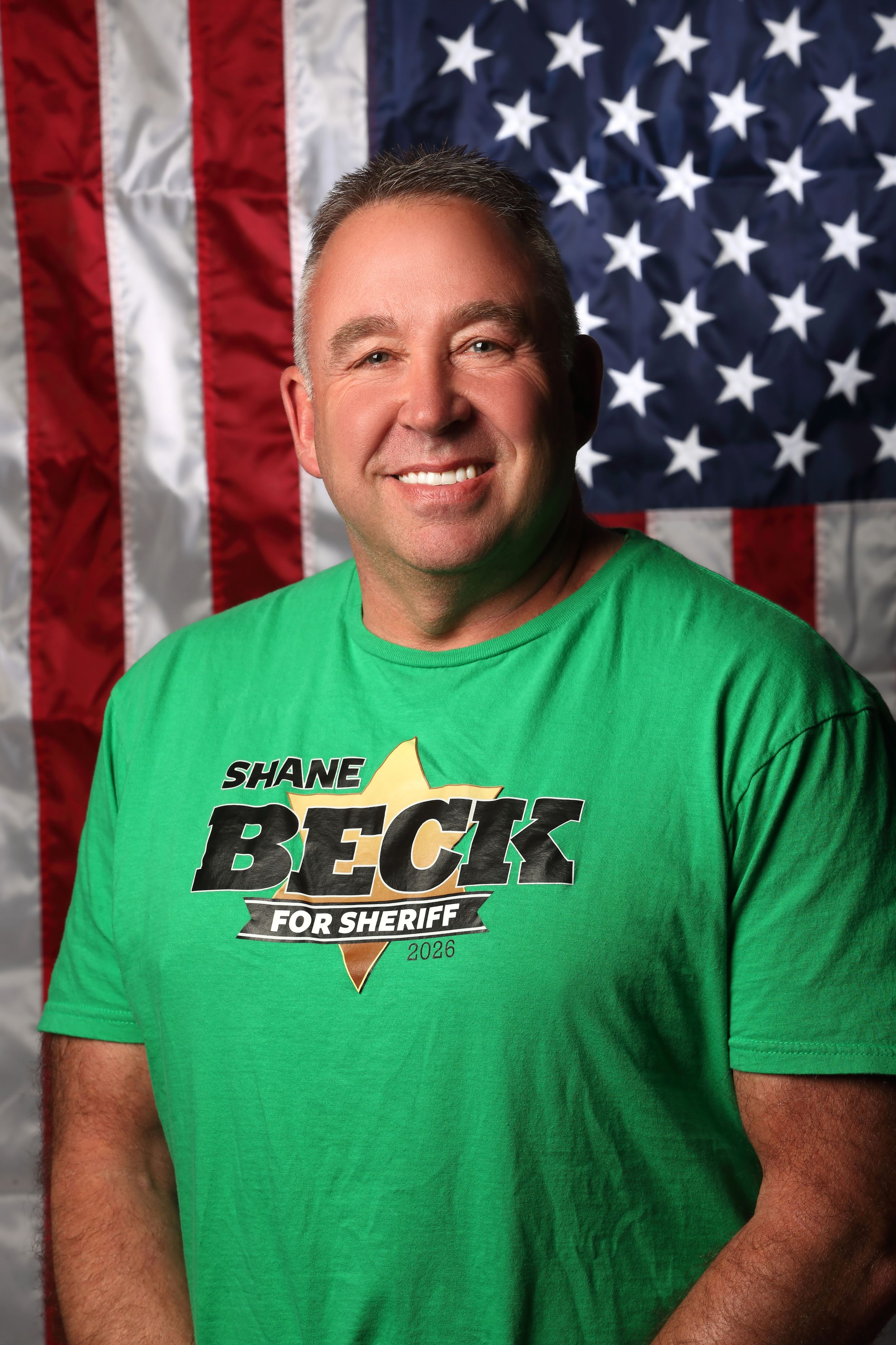 A series of campaign photos showing a person in a green t-shirt with a campaign logo against an American flag backdrop.