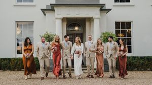 A panoramic collage of a wedding party in formal attire standing outside a white building with windows.