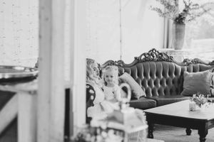 Bride and flower girl enjoying a quiet moment on wedding dayL