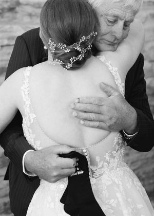 Father hugs daughter after received gift before the wedding