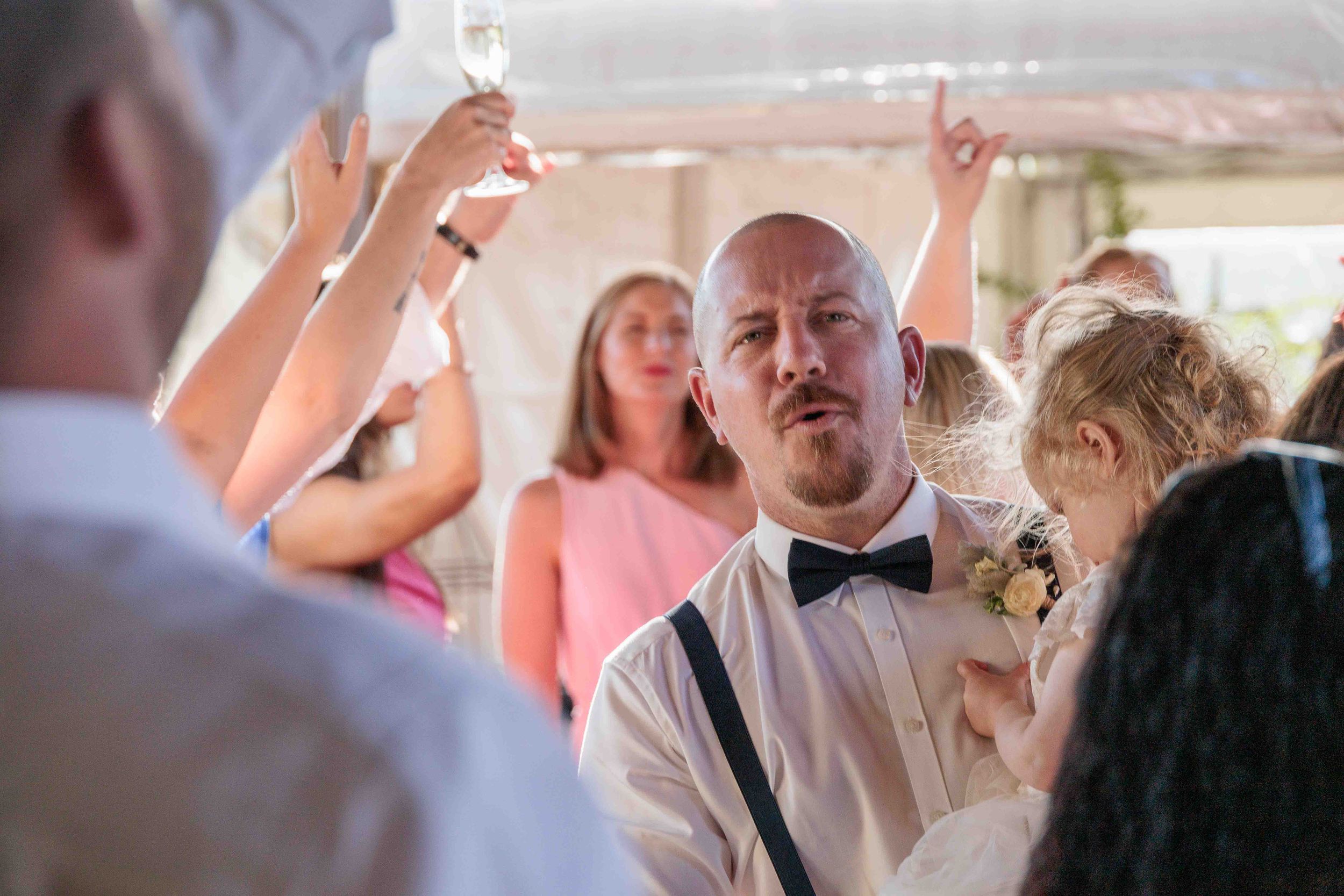 Groom among guests.