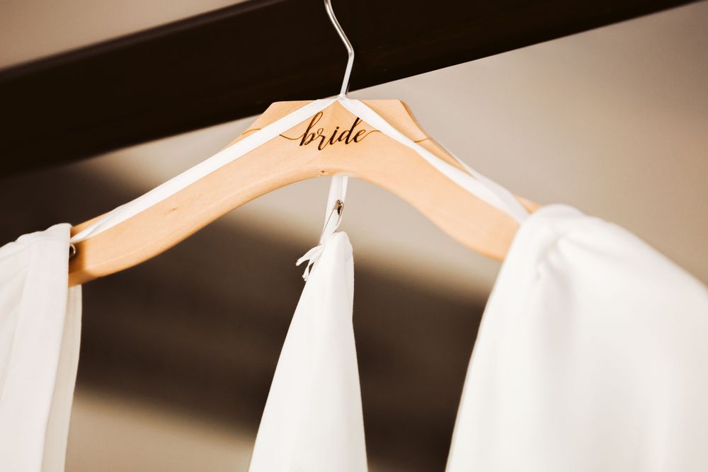 Bride’s wedding dress on hanger Maine