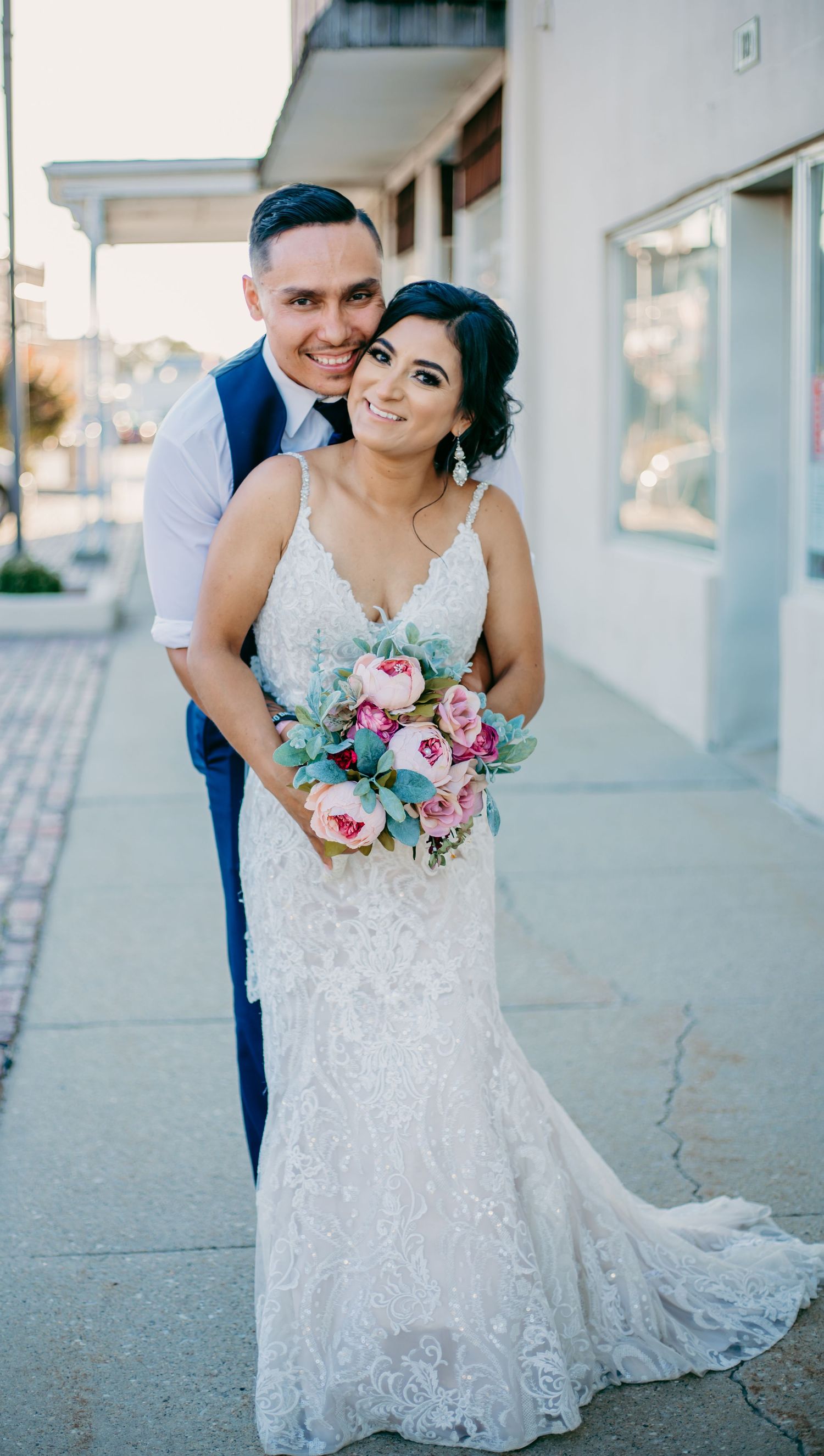 bride and groom bridal portraits on a main street strip mall