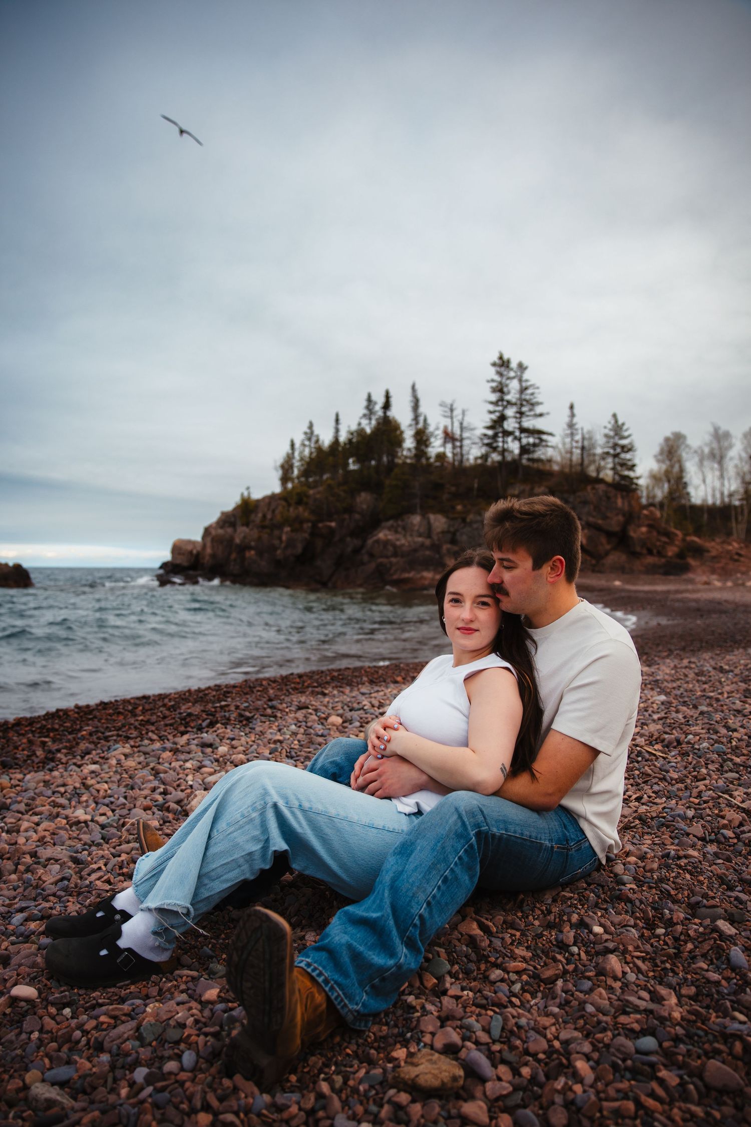 Northern MN couple at a maternity shoot on The Black Beach in Silver Bay, MN.