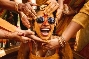 Festive celebration with colorful decorations and joyful moments at an Indian wedding ceremony.
