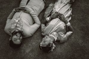 Artistic black and white photograph capturing intimate moments on the ground.