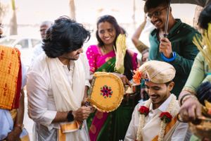 Traditional Indian wedding celebration with guests in colorful attire and festive decorations.