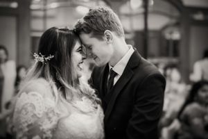 Intimate black and white wedding portrait capturing a tender moment.