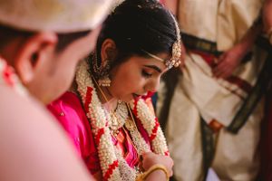 Artistic wedding photography capturing intimate ceremony moments and traditional details.