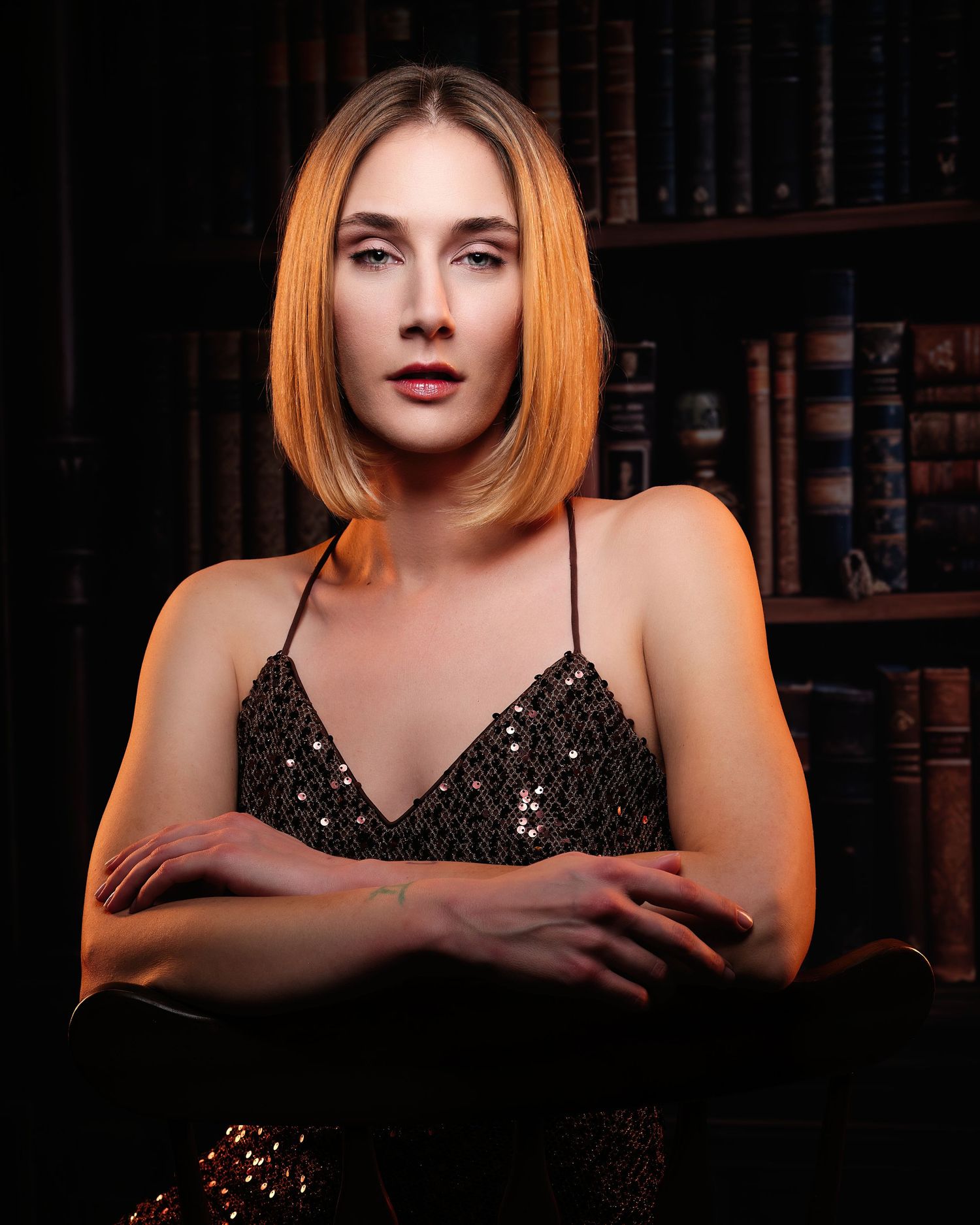 David G Holt Photography - Woman in black sequin dress poses elegantly against dark background in glamour portrait series.