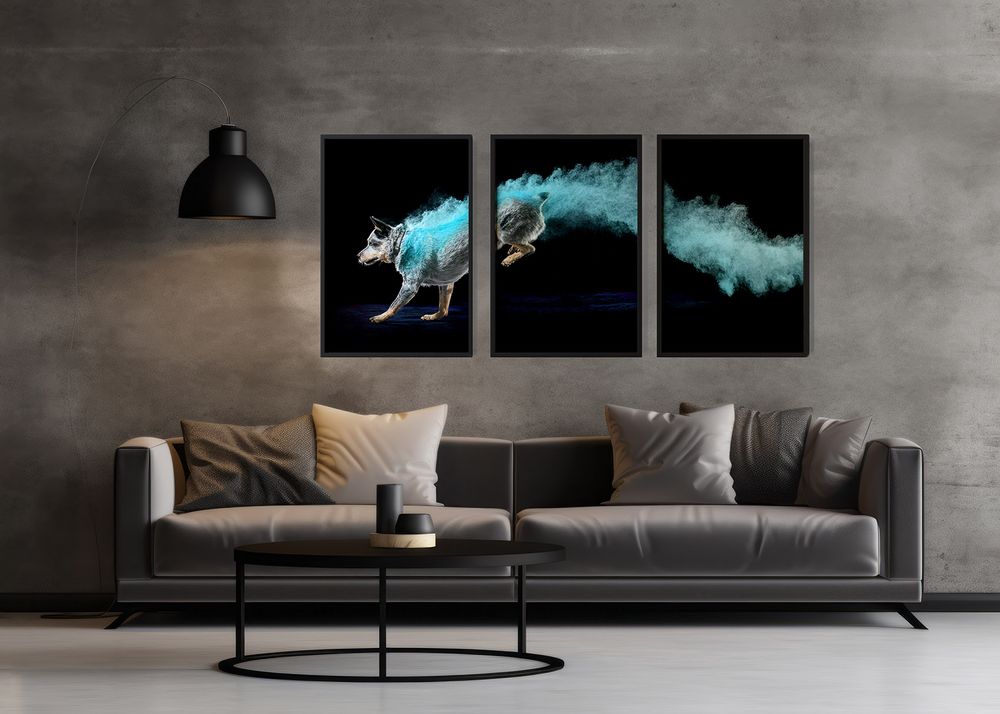 Modern living room with gray sofa and striking blue wolf triptych art on concrete wall above black coffee table.