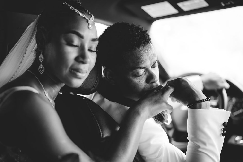 Black and white intimate wedding portraits showing tender moments between newlyweds.