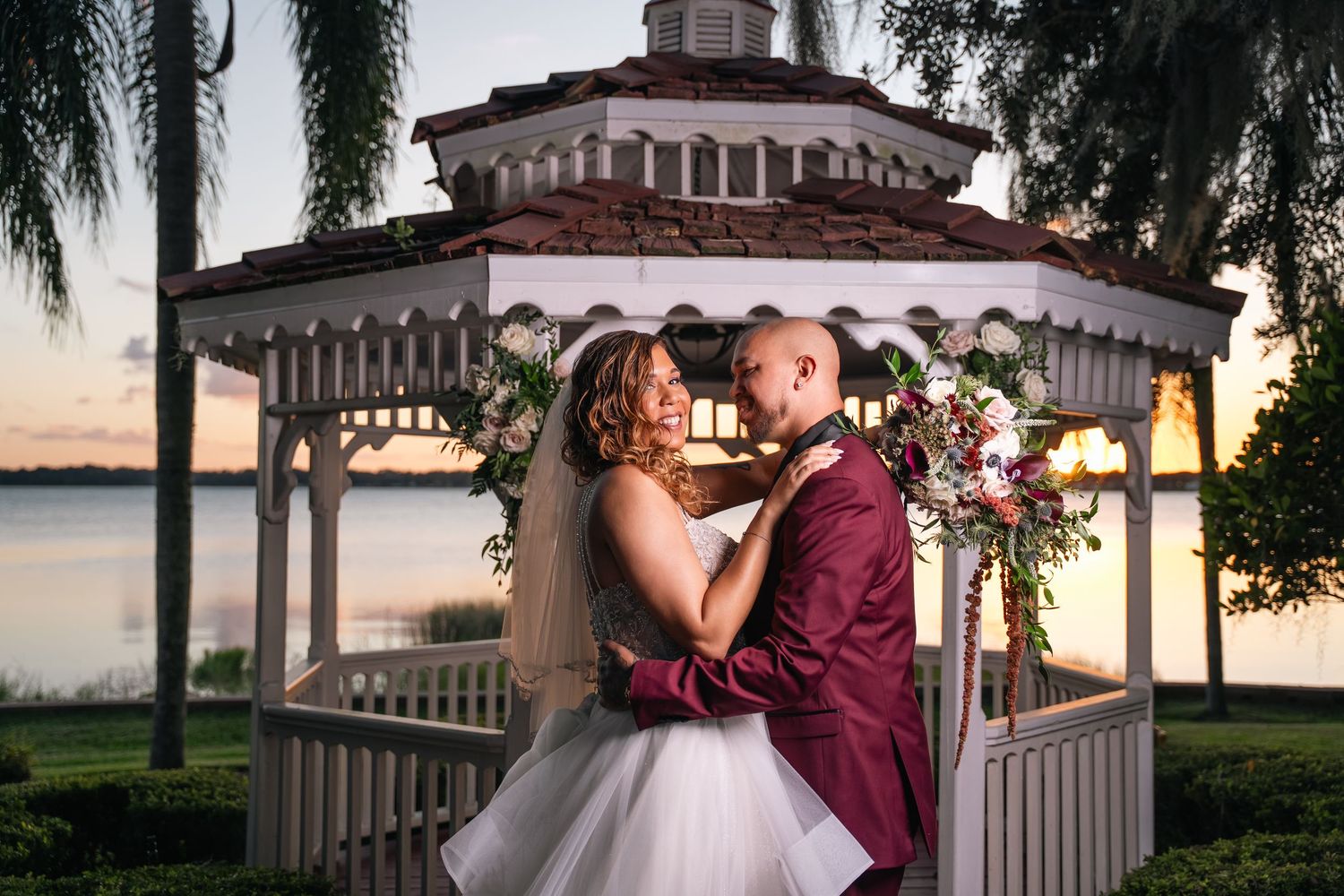 Newlyweds share their first dance as sparkling confetti fountains light up the ballroom.