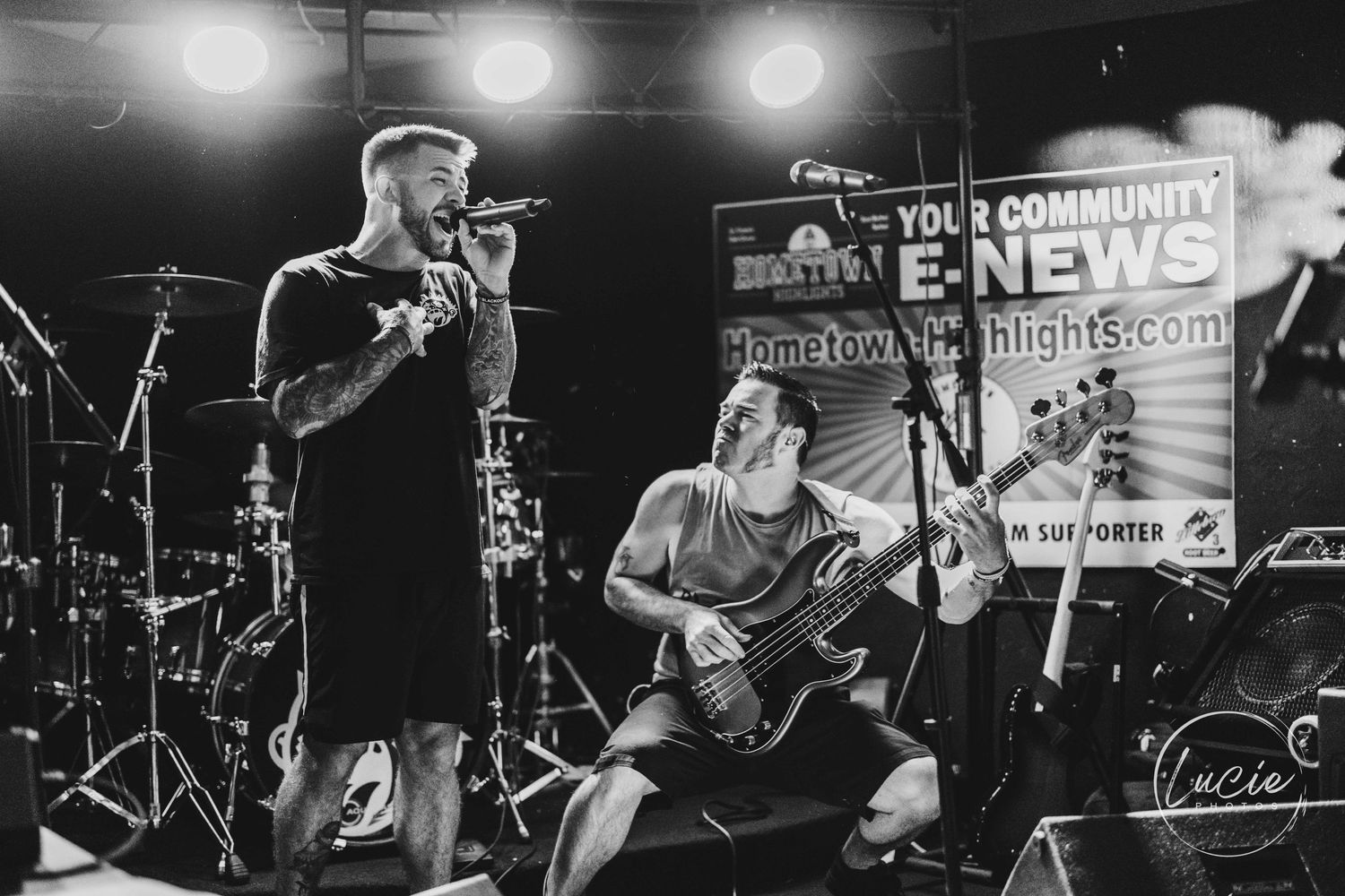 Black and white photos of musicians performing on stage during a rock concert with dramatic lighting and instruments.