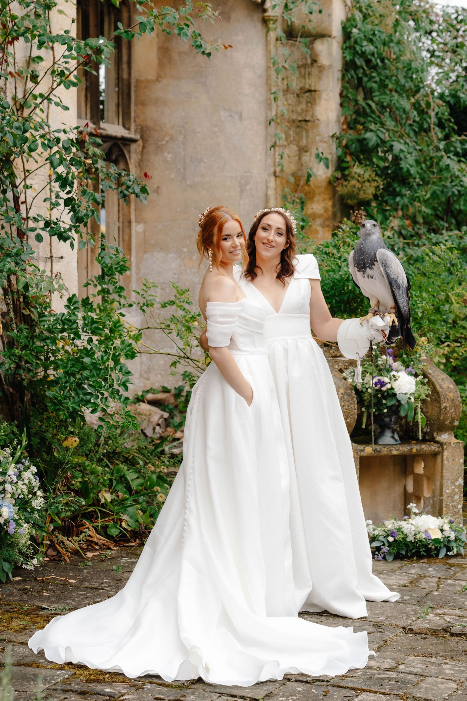 Zara Davis Wedding Photographer Cotswolds Gloucestershire Cheltenham Gay Lesbian Wedding LGBTQ Sudeley Castle brides holding bird of prey