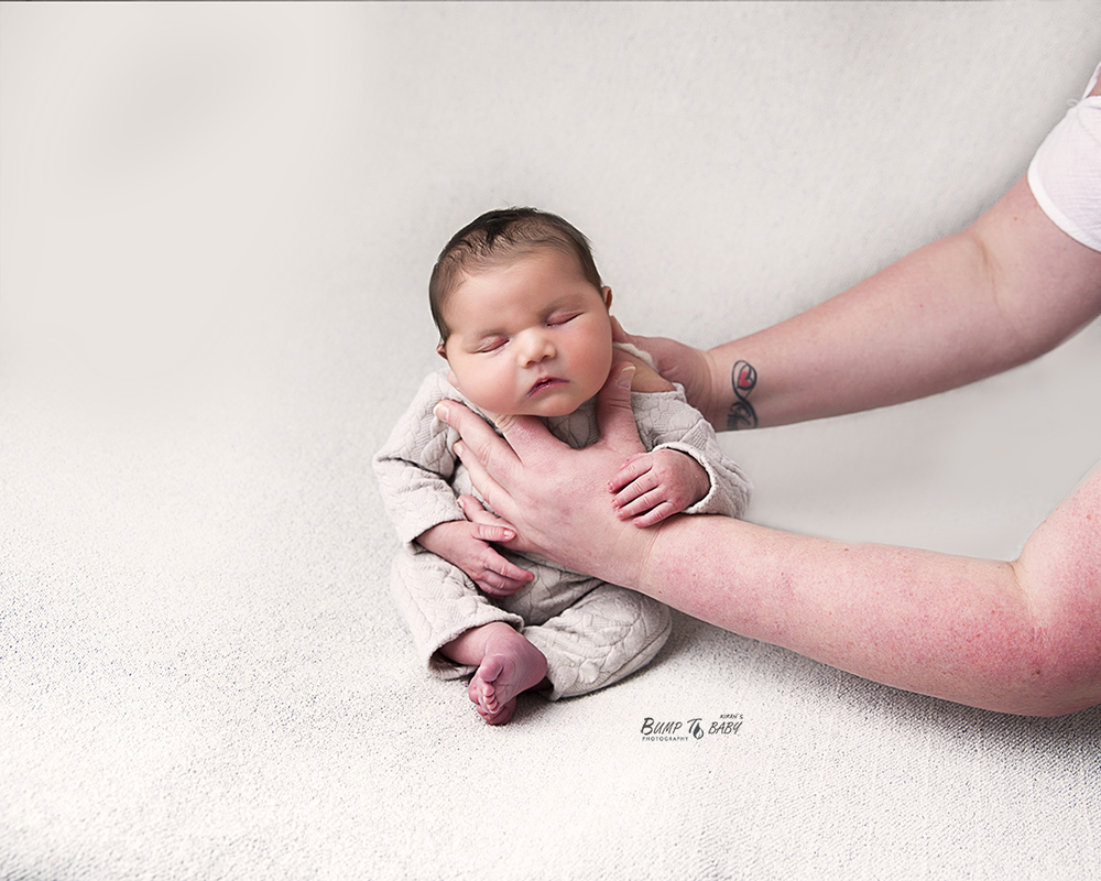 newborn baby in floral setup professional photography