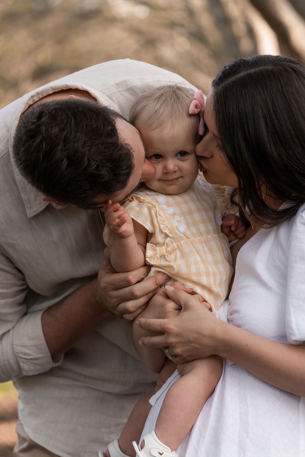Intimate family moment captured in series of close-up photographs.