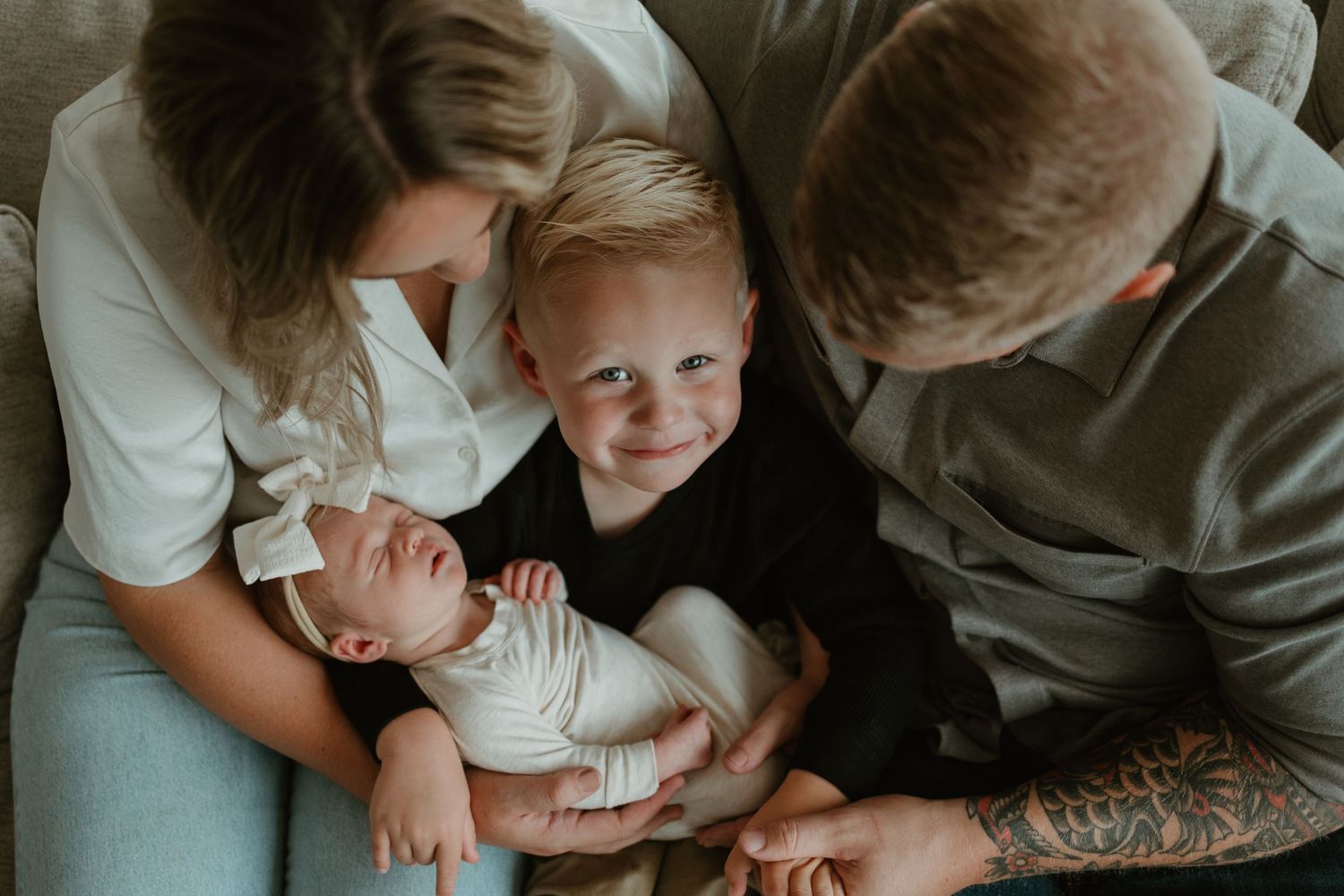 A loving family shares tender moments and cuddles together in a series of intimate black and white photographs.