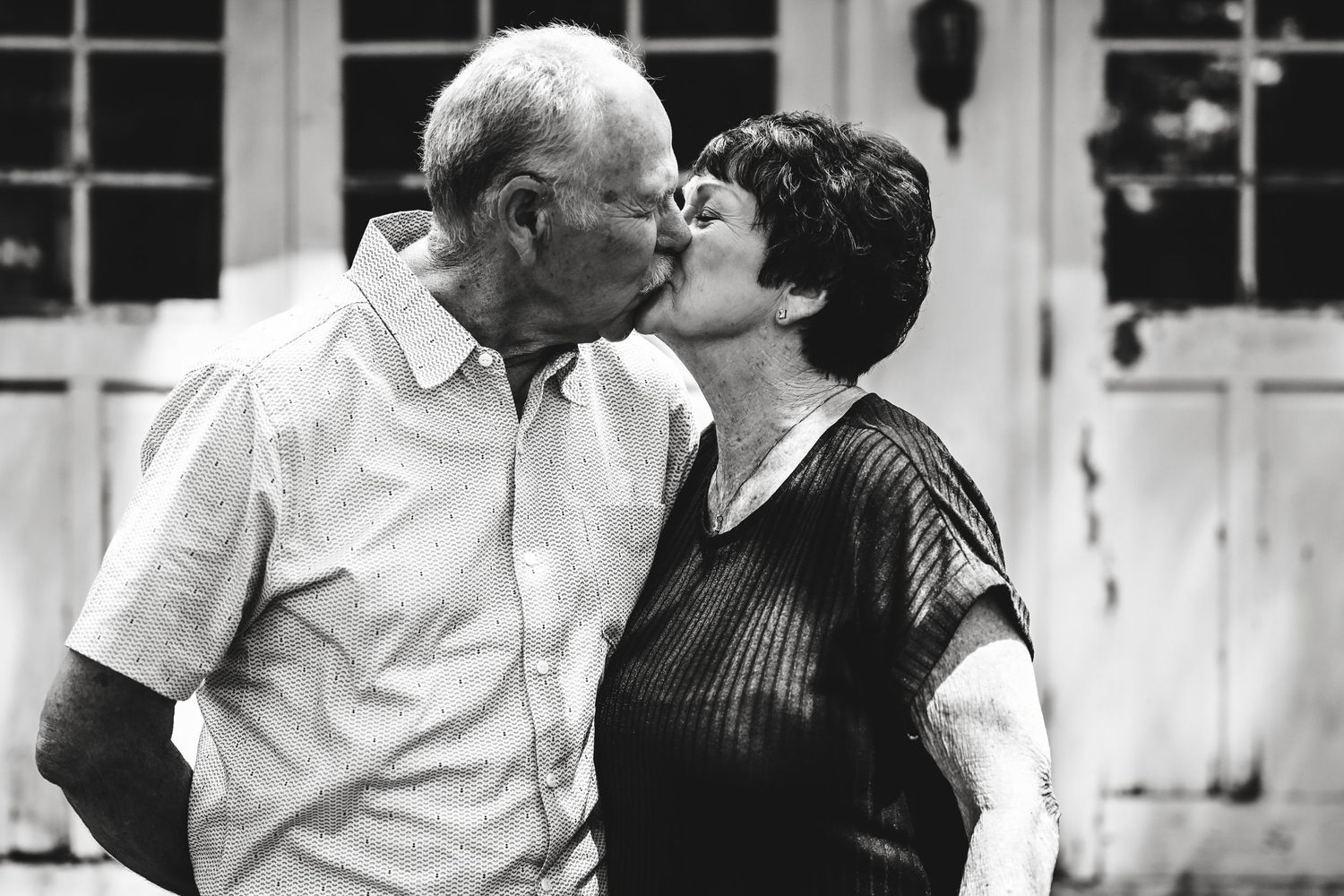 Older couple embrace.