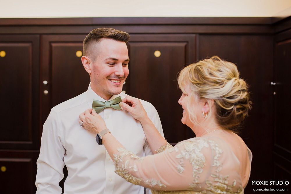 Elegant wedding reception dance sequence showing couples swaying in a dimly lit ballroom with warm lighting.