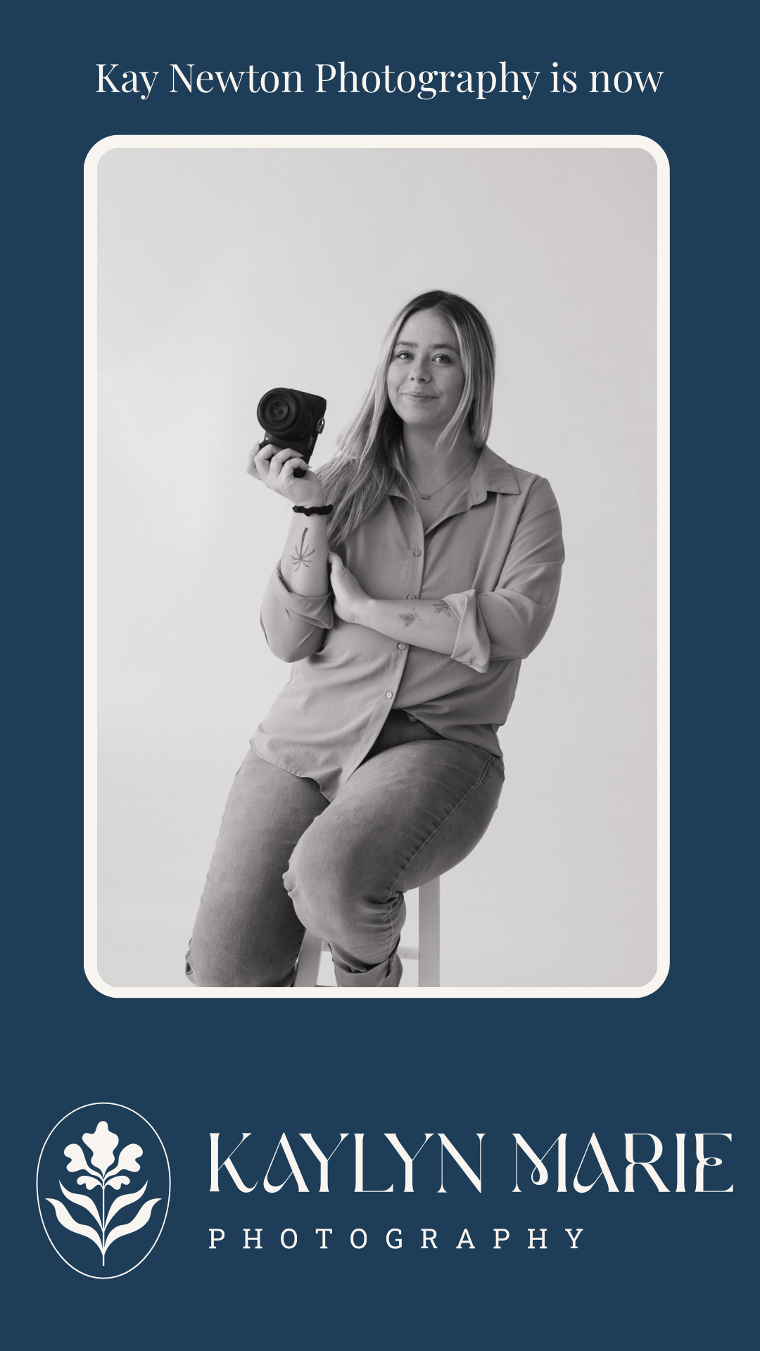 Kaylyn Marie Photography branding photo of blonde female photographer holding camera while seated on stool.
