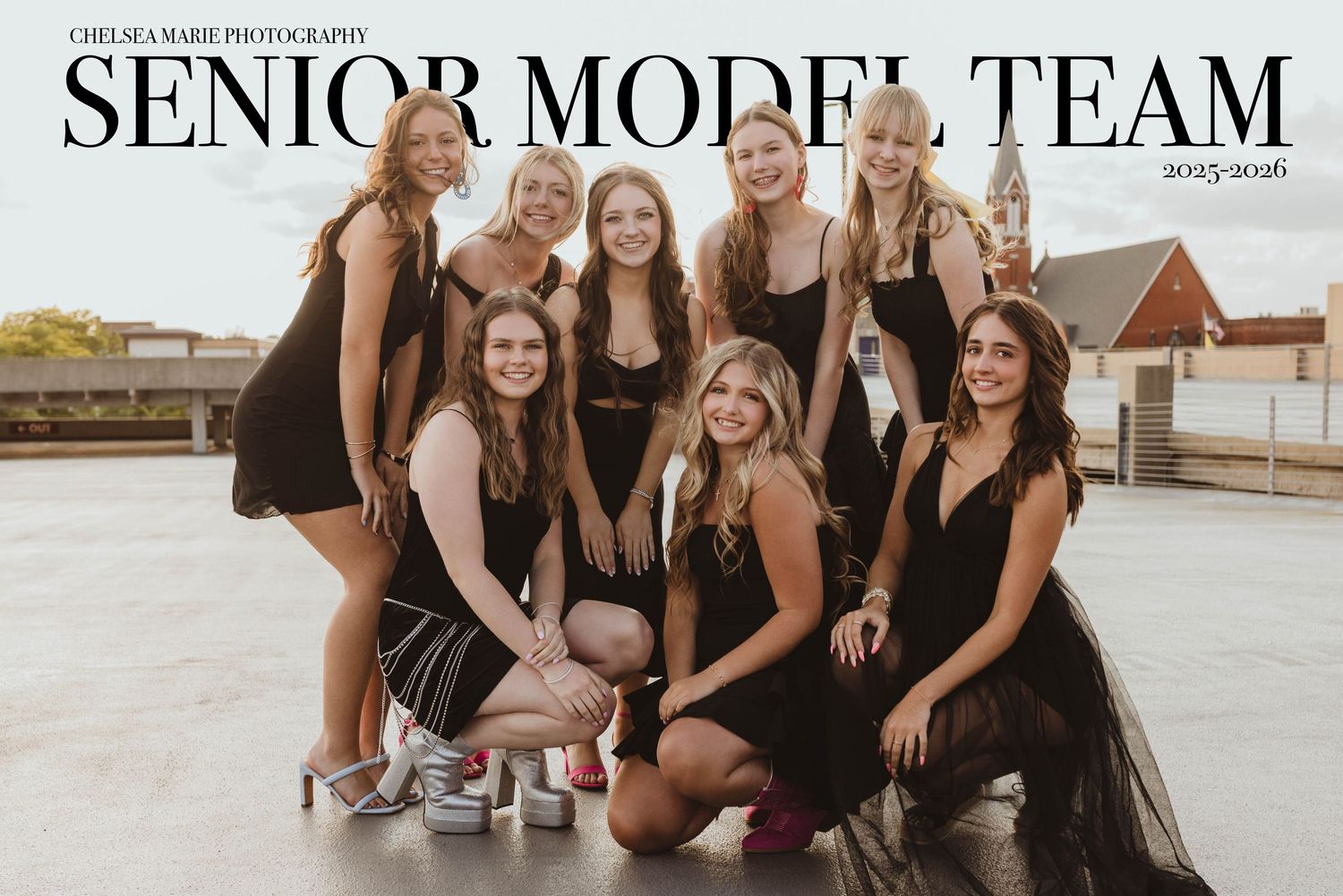 Group photo of model team posing together outdoors.