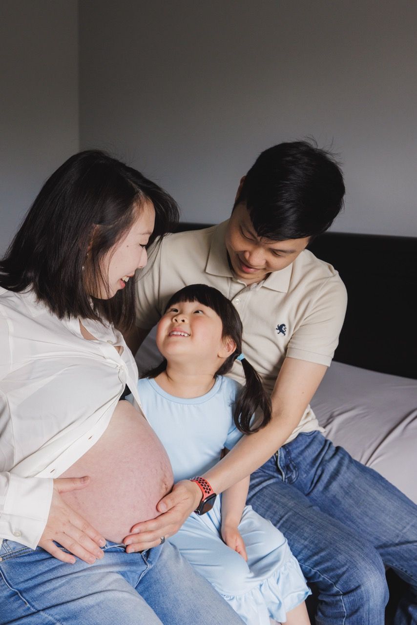 Candid moment of a family awaiting a new baby in Everett. Raw and affectionate photos by Tim Neal.