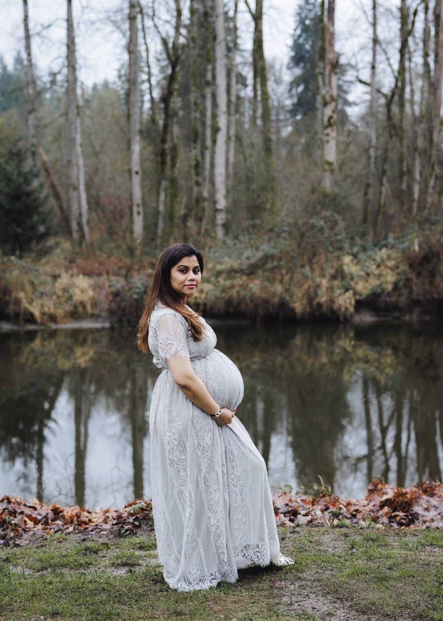 Maternity portrait of a woman in a flowing dress in Snohomish. Raw and authentic photography by Tim Neal.