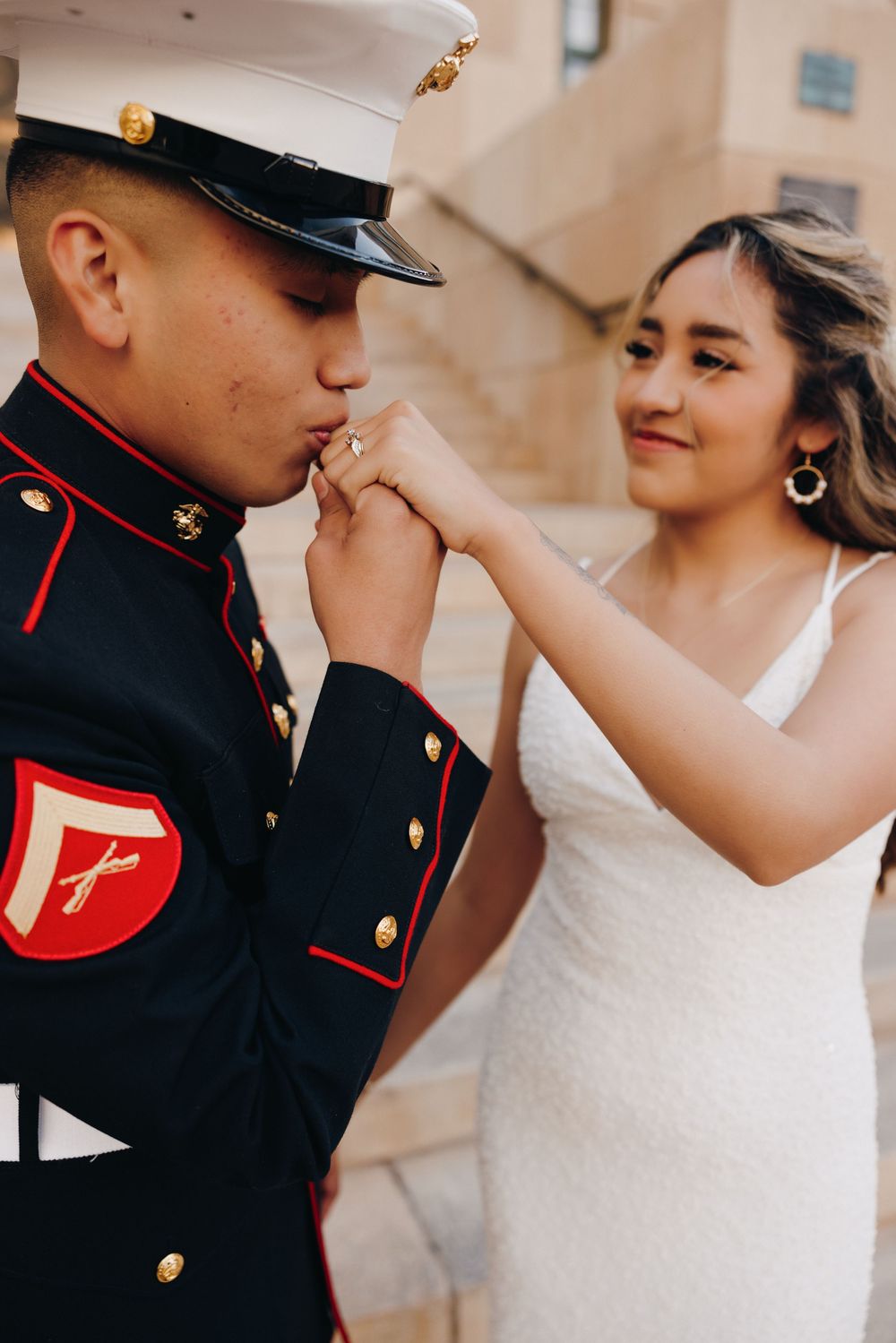 Kissing his brides hand in Downtown Phoenix.