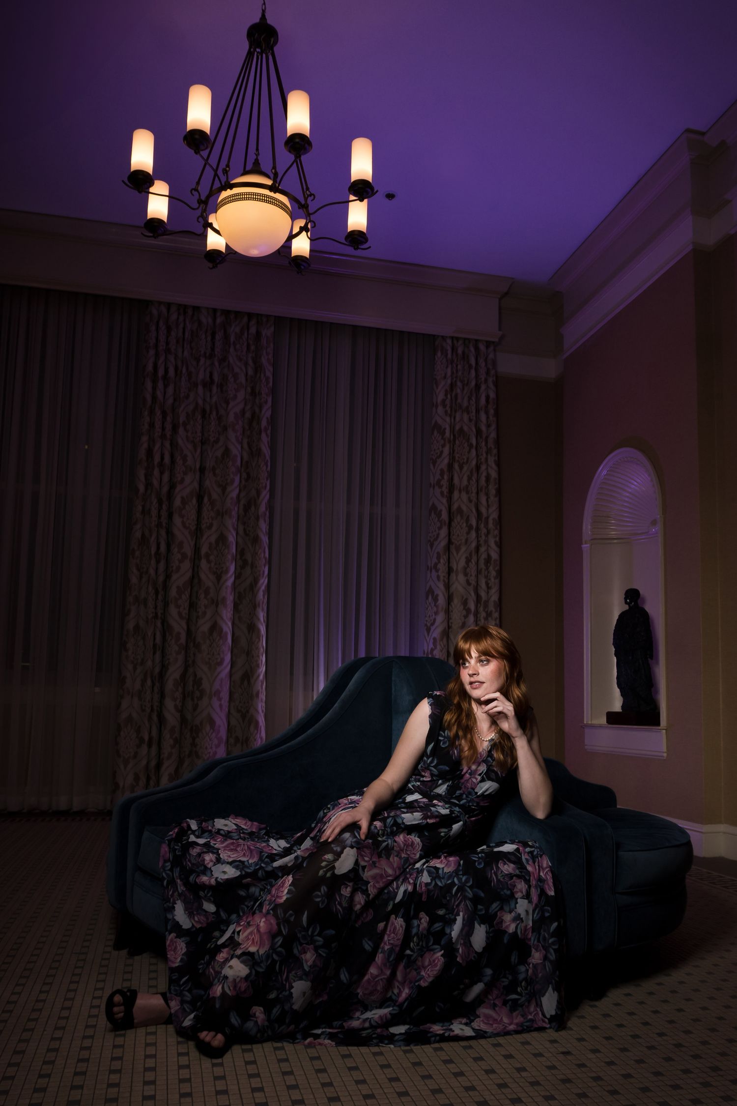 woman posing in dress at hotel event