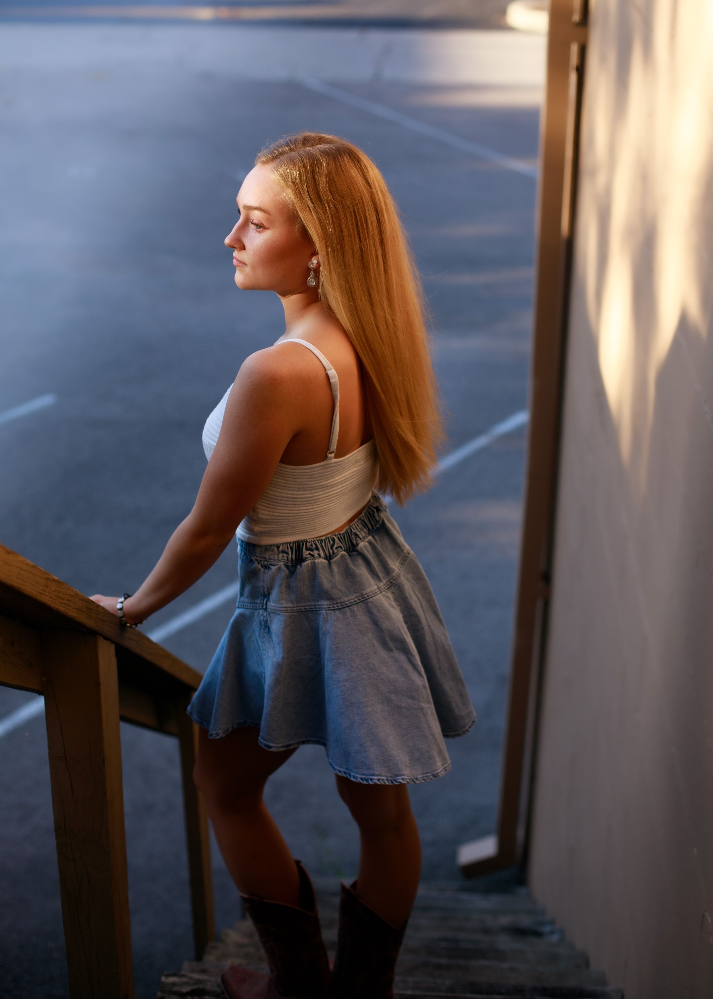 Artistic portrait with evening light showing silhouette against urban background.