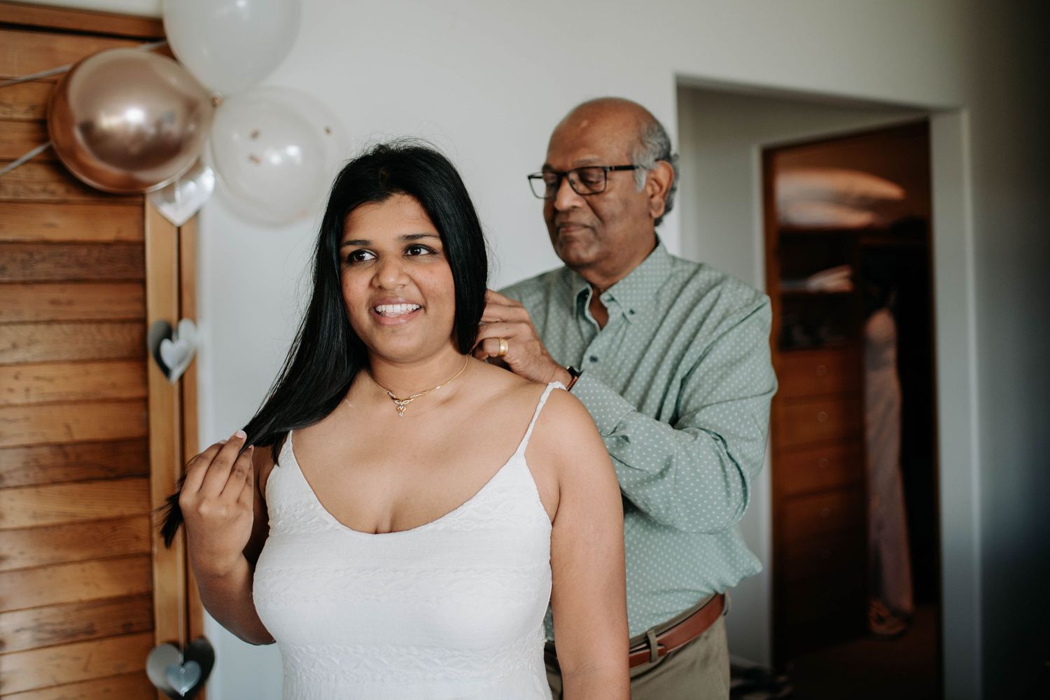 A heartwarming getting-ready moment captured during wedding preparations.