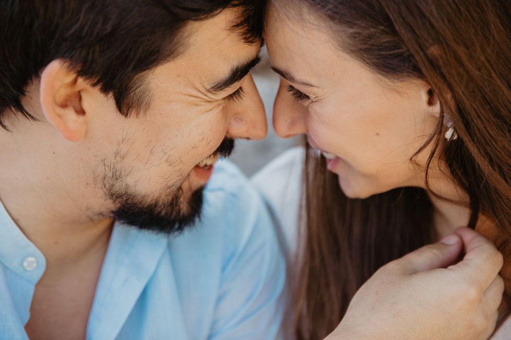 Close up profile shots showing intimate moments between a couple outdoors.