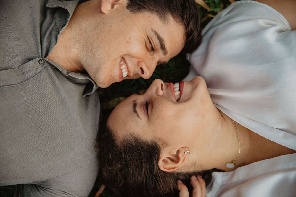 Intimate close-up shots showing tender moments between two people on white bedding.