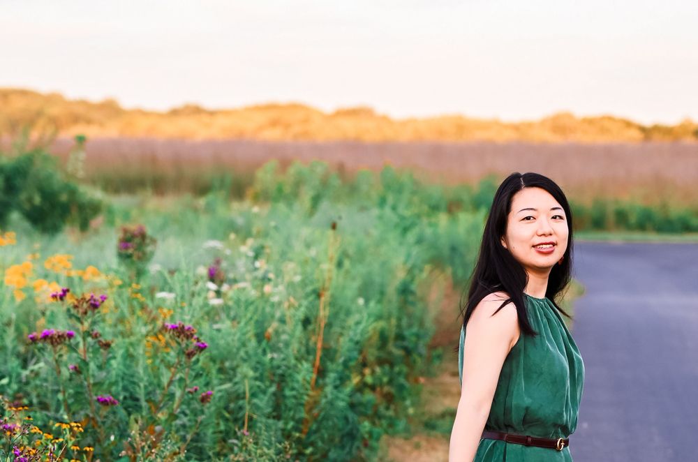 Young woman poses in wildflowers at Prophetstown State Park.