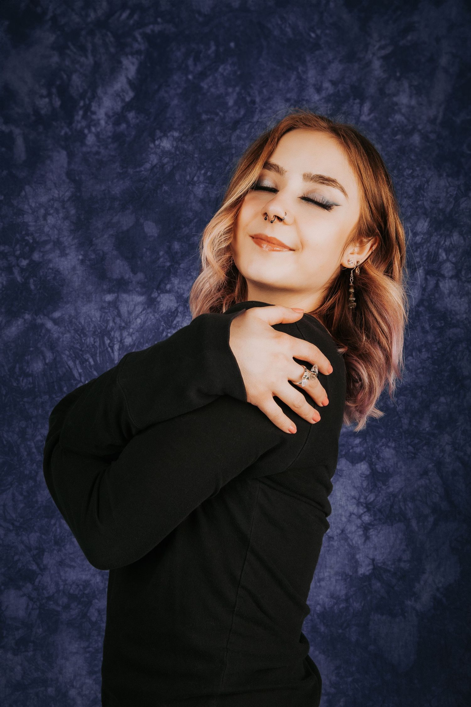 Emotive portrait sequence showing dynamic poses against a moody blue background.