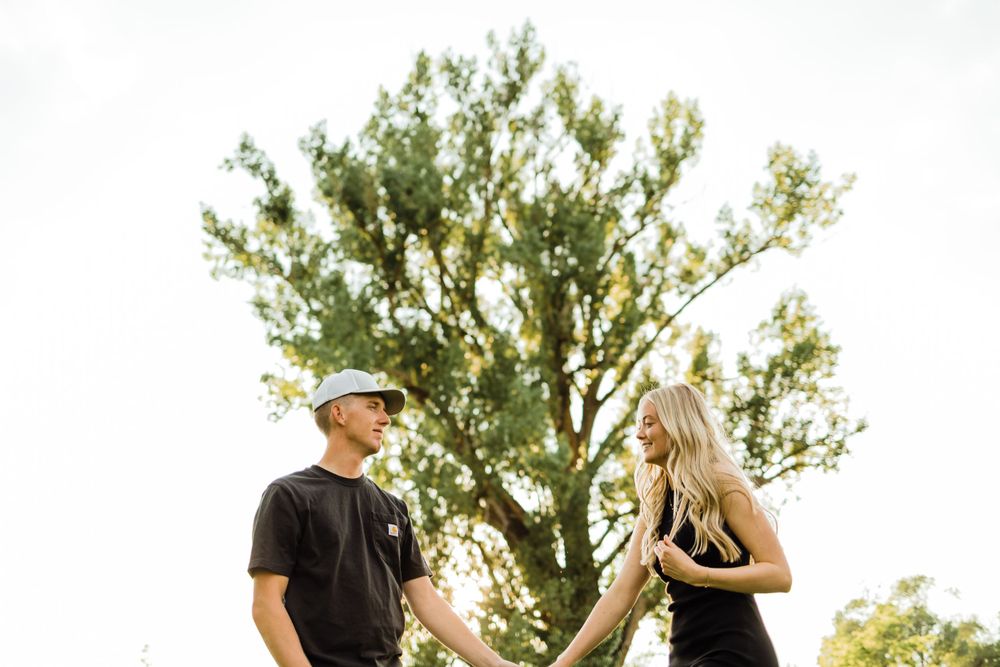 Wedding Engagements Under Tree Wearing Black