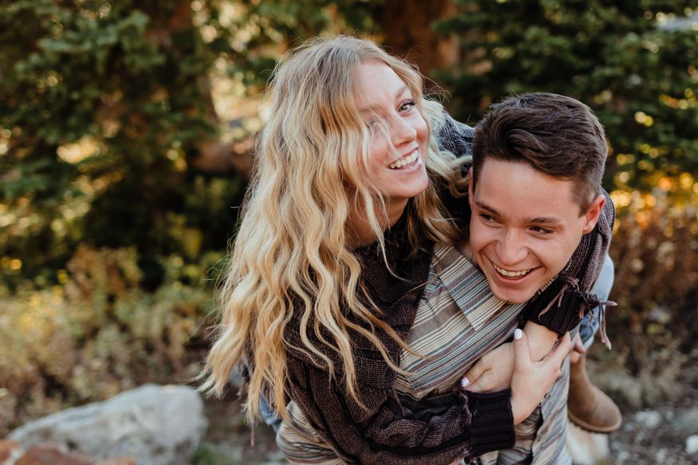 Utah Engaged Couple Embracing in Mountains