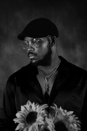 Dramatic portrait series showing person in cap and glasses with floral elements.